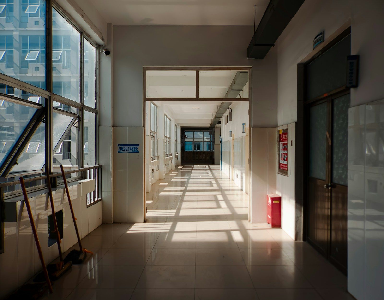 A quiet, sunlit hallway before a hard conversation